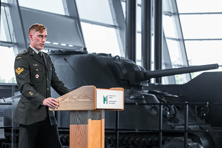 A Canadian soldier presents at a commemorative event at the Canadian War Museum.