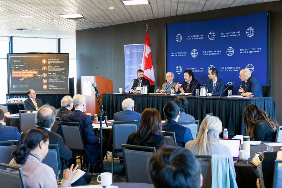A panel of experts presents to a full room attending the institute for peace and diplomacy conference at the Delta Ottawa City Centre.