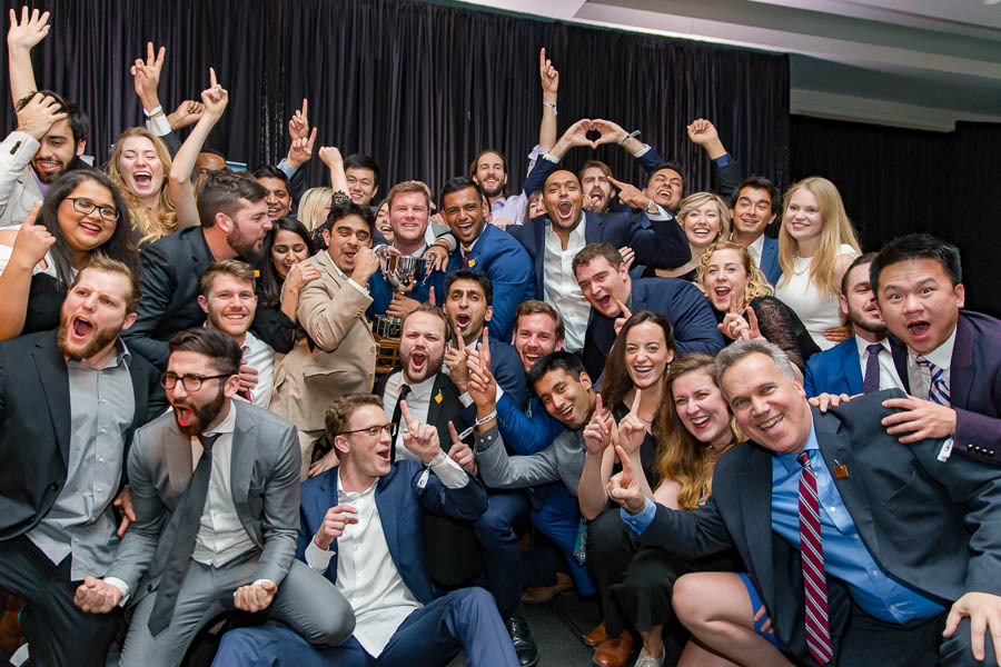 A large team photo of MBA students taken during a conference event at the Westin Ottawa.