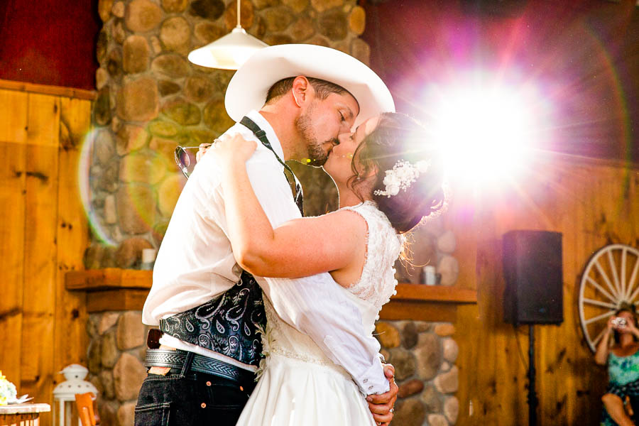 April and Pierre share a kiss on the dance floor during their cowboy themed wedding at the LoneStar Ranch in Ottawa.