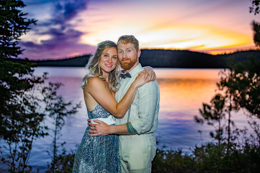Liv and Andrew share an intimate moment at their lakeside cottage wedding in Calabogie, Ontario.